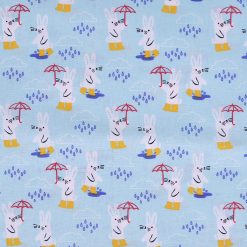 Bunnies In The Rain on Blue Novelty Cotton Fabric