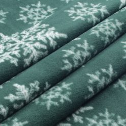 White Snowflakes on Green Anti Pill Fleece Fabric