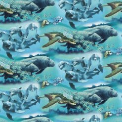 David Textiles Dolphins   Manatees on Blue Novelty Cotton Fabric